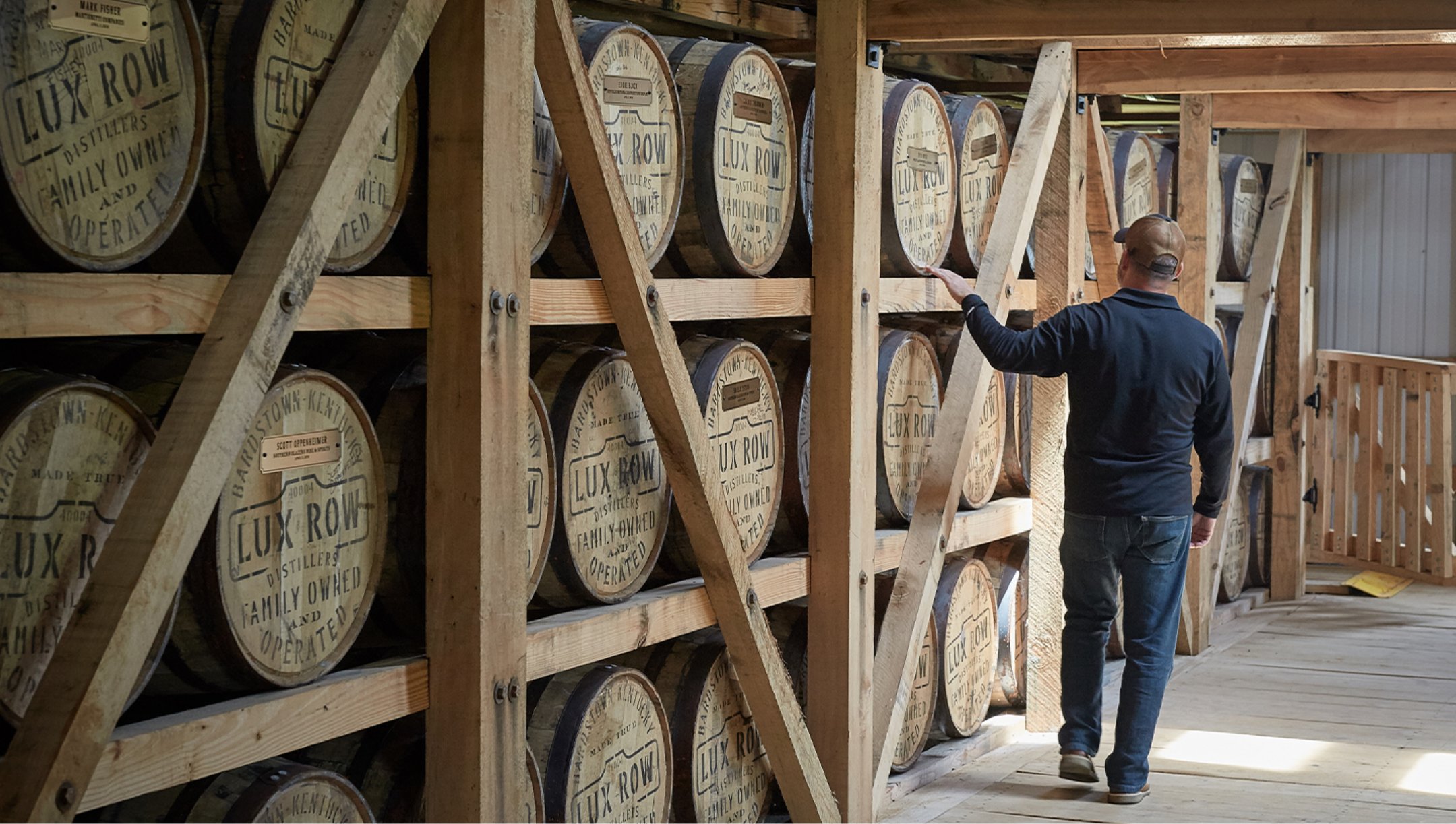 A distiller checks on the bourbon barrels at Lux Row Distilleries